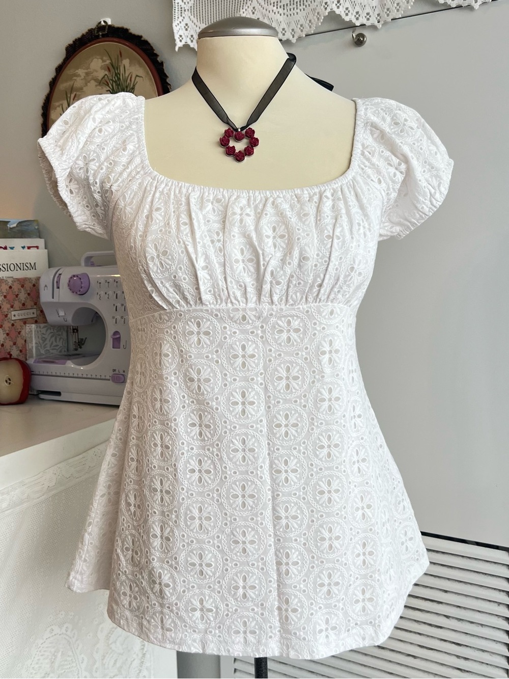 White eyelet lace babydoll blouse with circular floral pattern